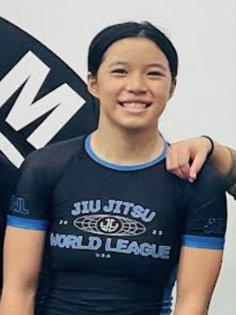 Coach Adalyn, women's Brazilian Jiu-Jitsu coach at Phenom BJJ, on the mats in Irvine
